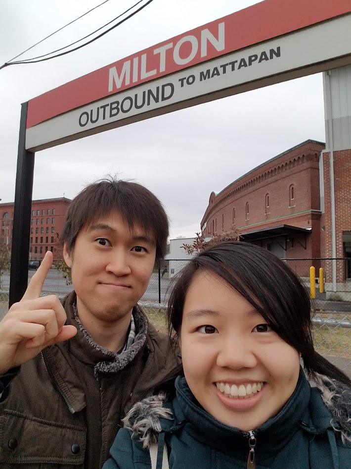 Smiling at Milton Station during an MBTA date adventure